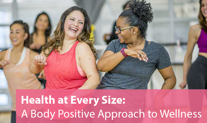 a group of happy women of all sizes in an exercise class